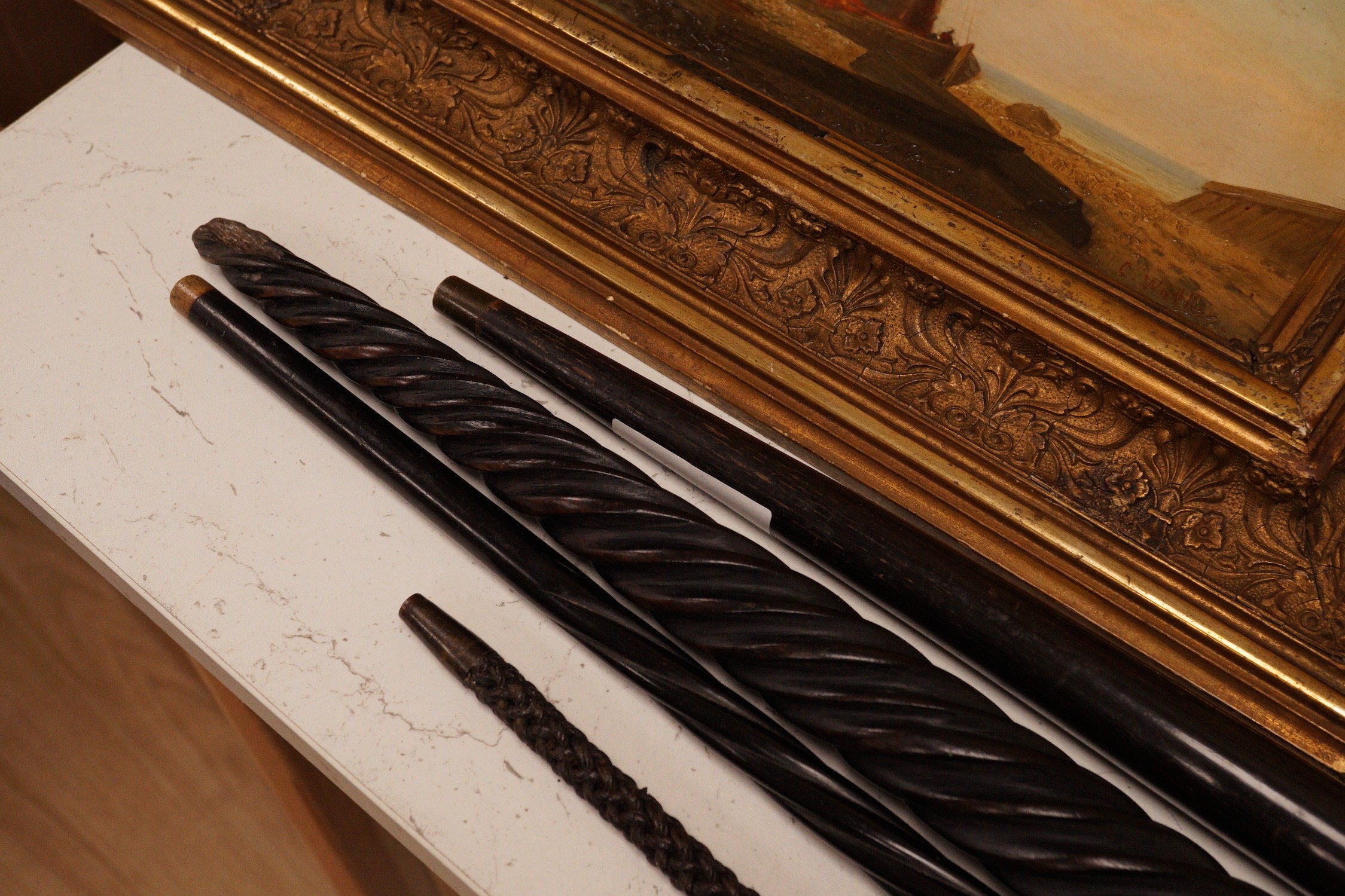 Four assorted canes to include a tapering horn example, a woven example, etc